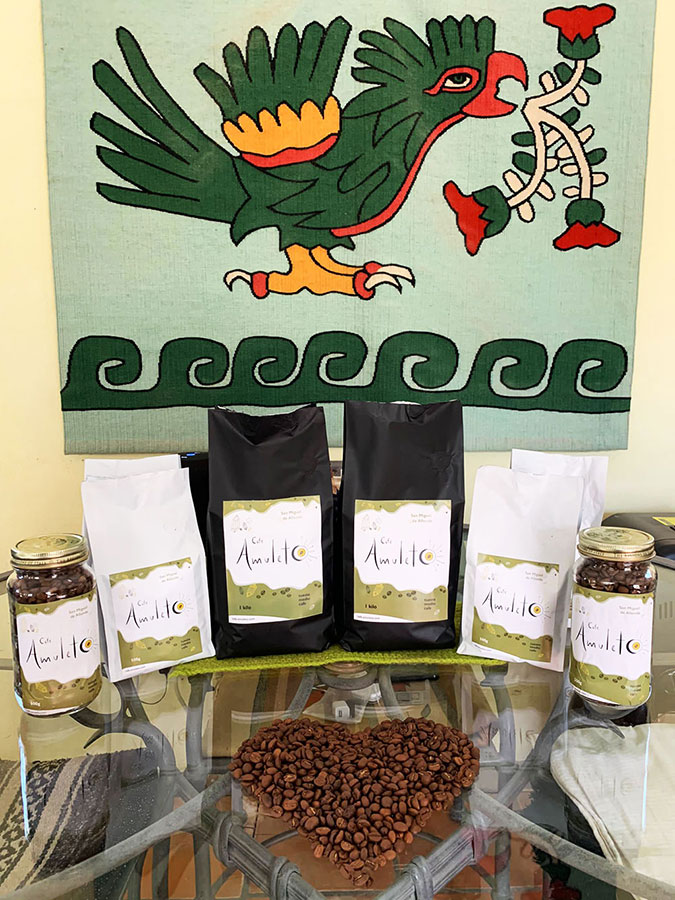 Bags of Cafe Amuleto and heart of coffee beans